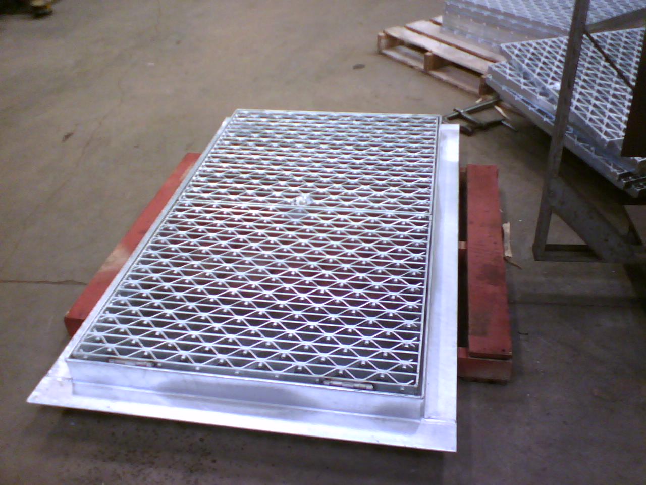 Steel sidewalk grate.